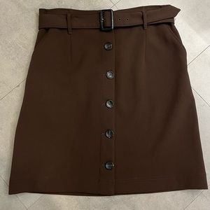 Brown wool, just above the knee skirt, worn once.  Marks & Spencers, UK size 14